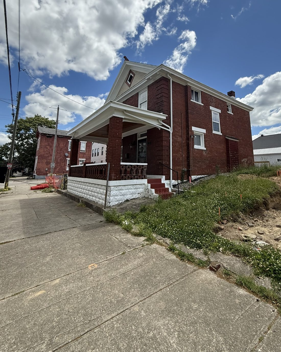 The Ann Street Hub — a historic red brick house at 134 W. 10th Street, Newport